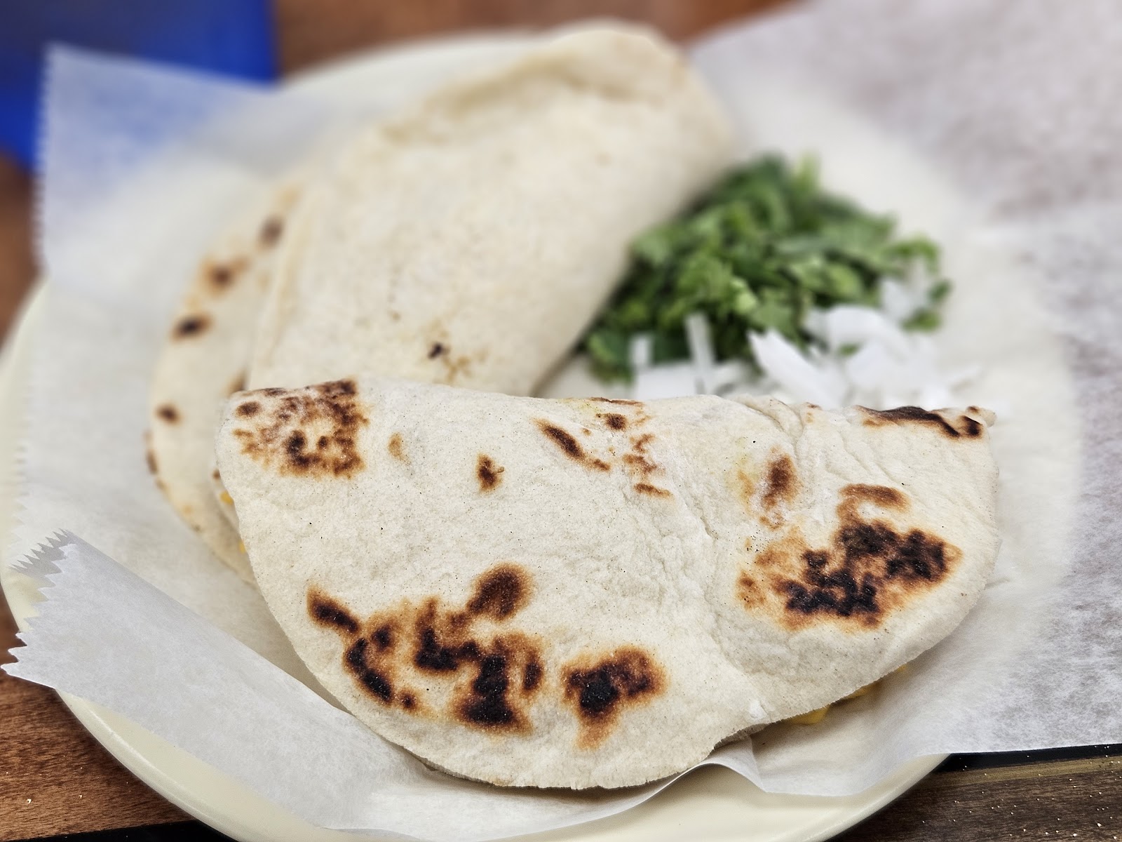 Al pastor style taco with grilled onions